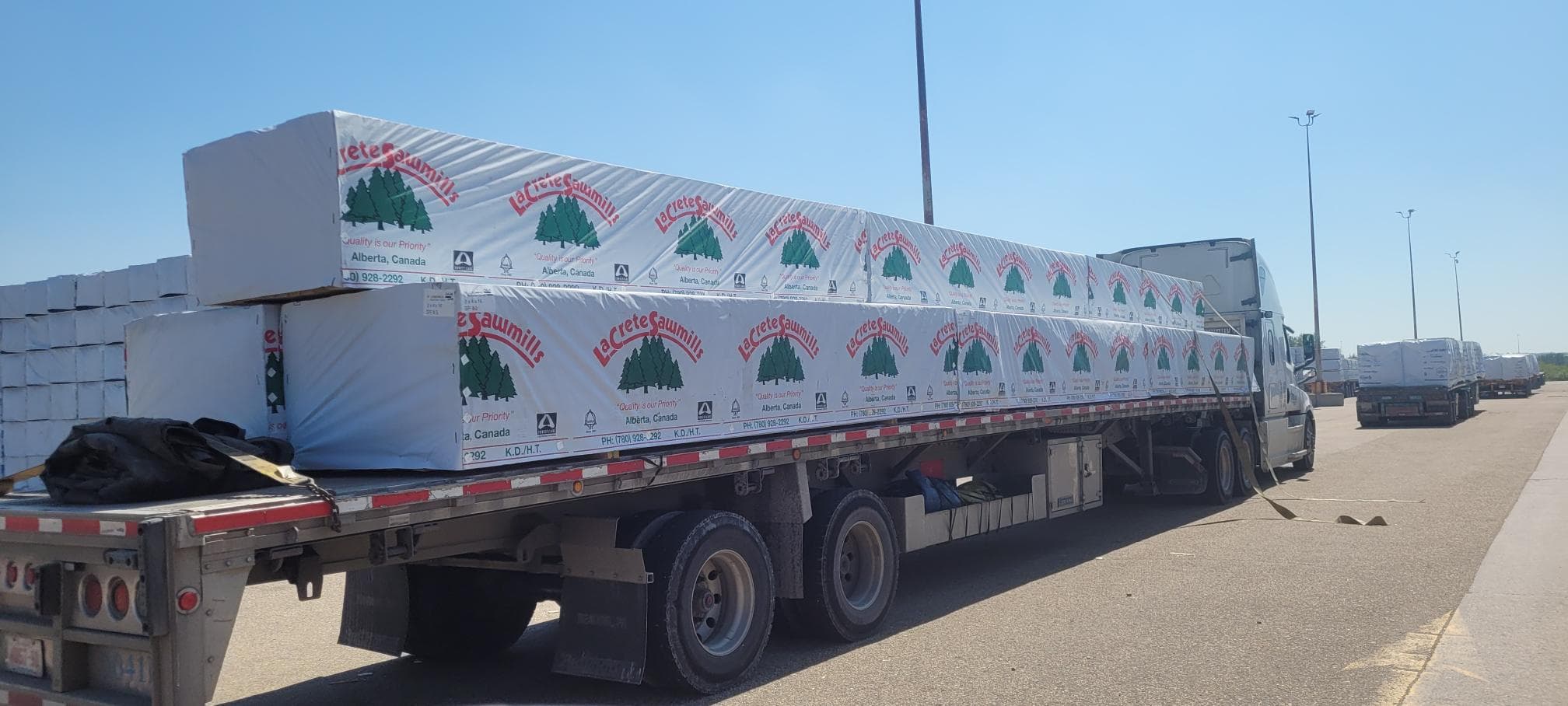La Crete lumber loading on trucks - Premium Canadian softwood lumber